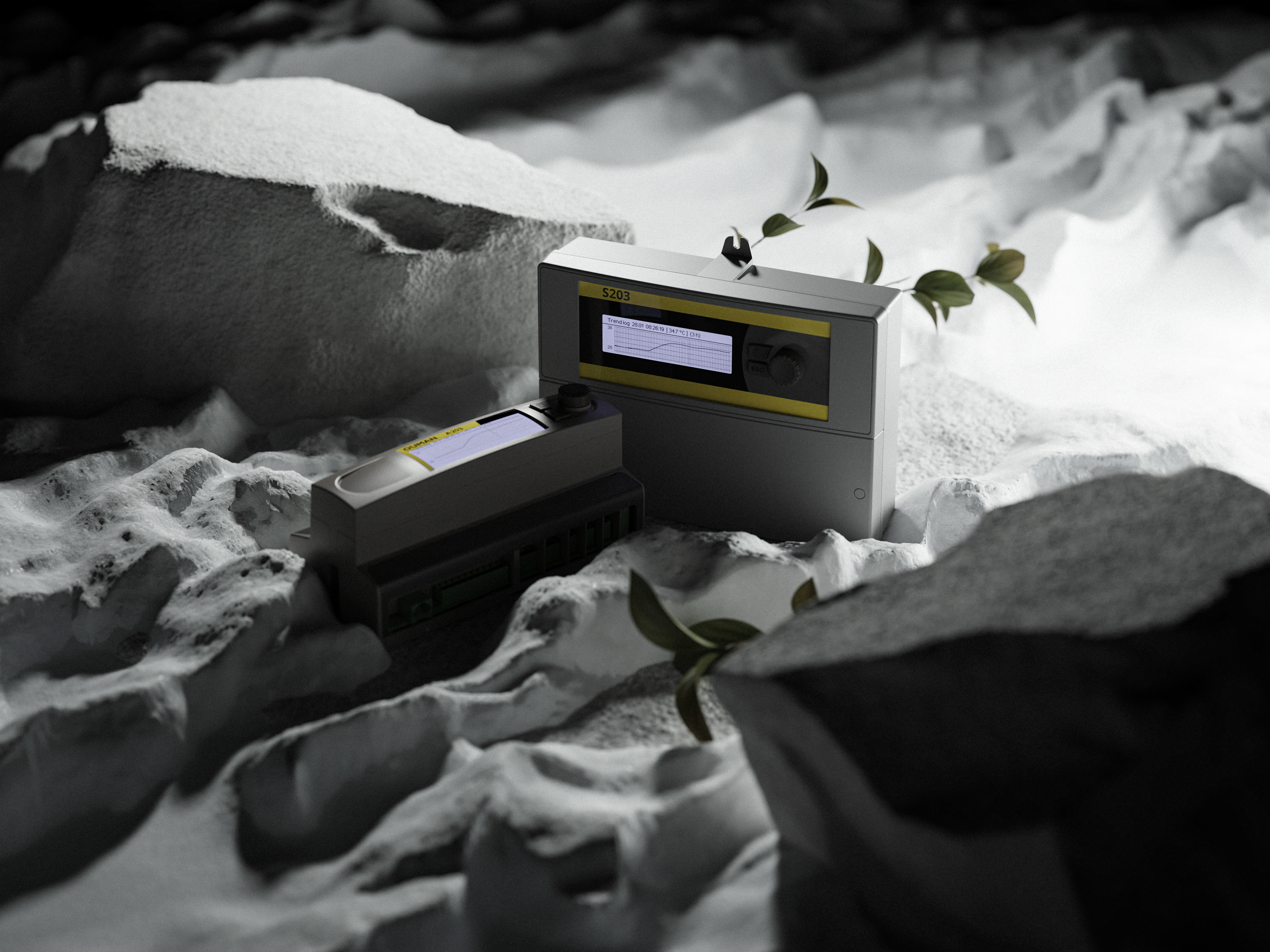 Ouman S203 and A203 heating controllers placed among white icy rock formations and snow in a studio setting.