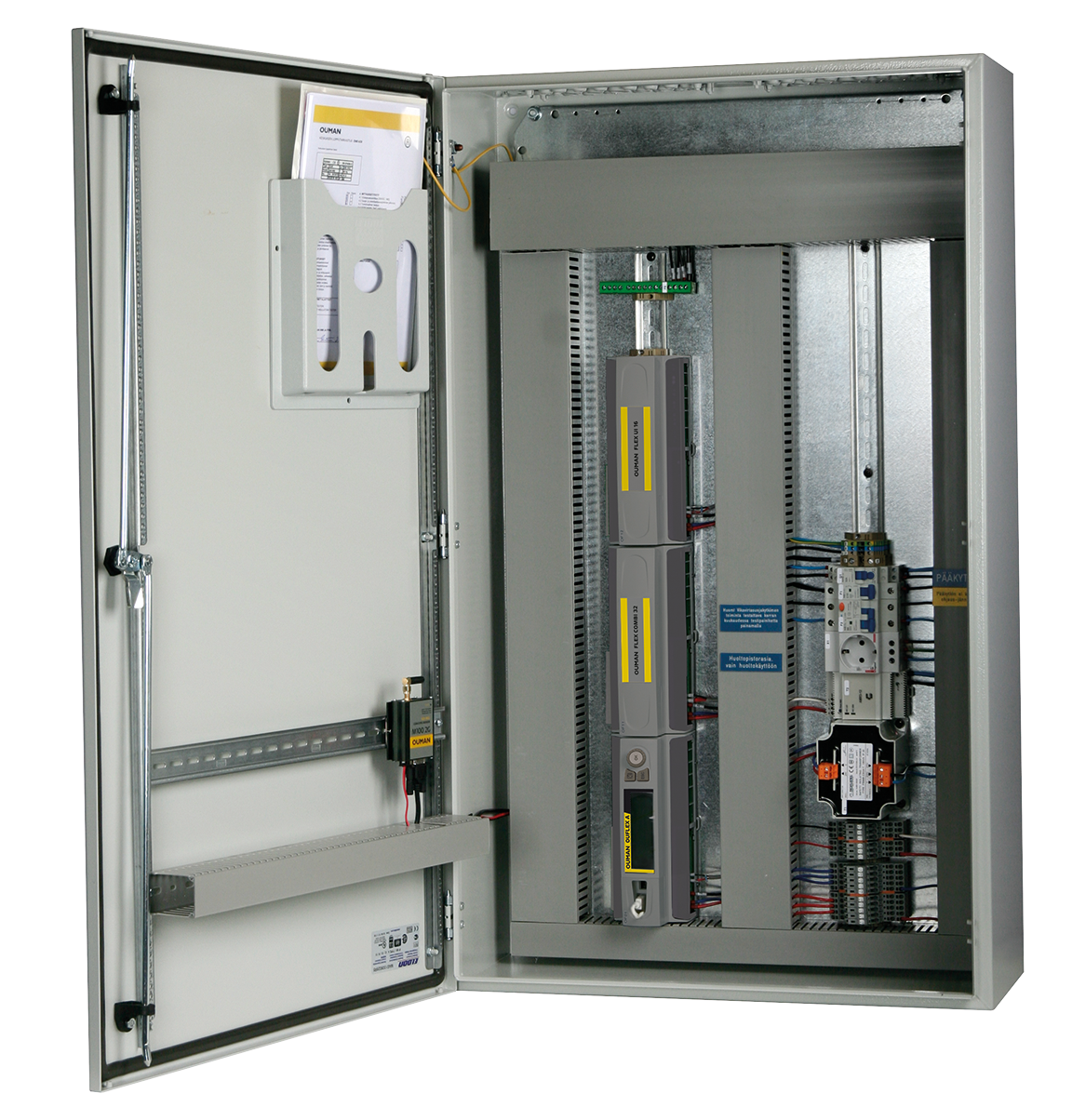 Electrical control cabinet with Ouman Ouflex building automation controllers and wiring installed.